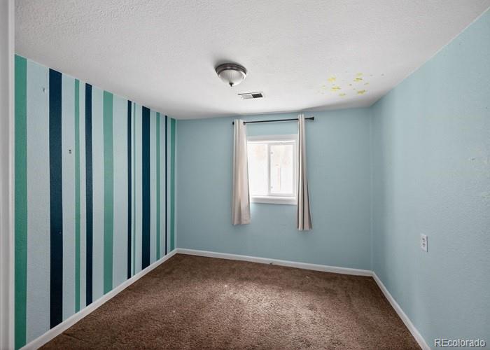 6498 South Turkey Creek Road Morrison, CO 80465 - Photo 13 of 19 a view of a livingroom with a staircase
