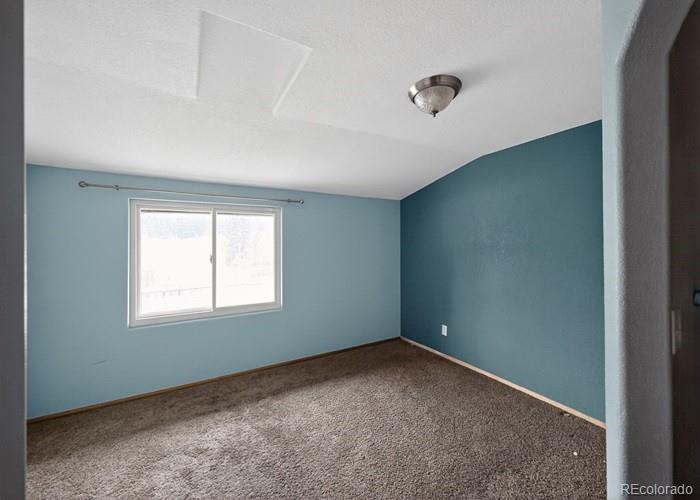 6498 South Turkey Creek Road Morrison, CO 80465 - Photo 16 of 19 an empty room with a window