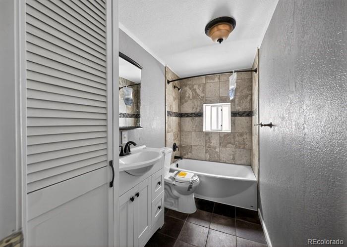 6498 South Turkey Creek Road Morrison, CO 80465 - Photo 19 of 19 a bathroom with a sink a toilet and shower