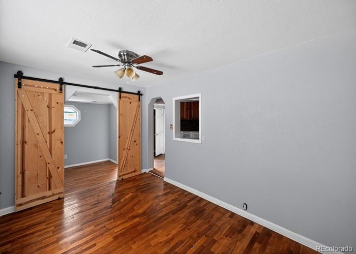 6498 South Turkey Creek Road Morrison, CO 80465 - Photo 10 of 19 a view of empty room with wooden floor
