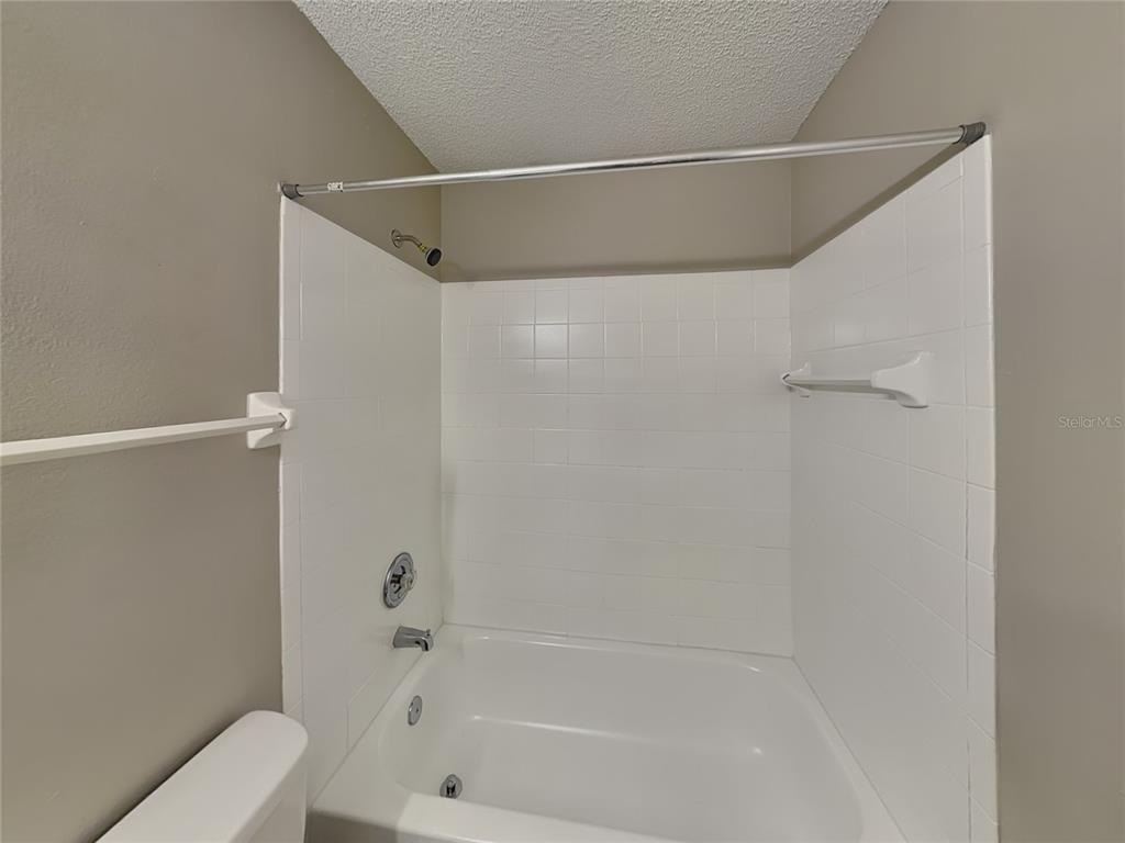 Undisclosed Address Deltona, FL 32738 - Photo 9 of 18 a bathroom with a bathtub and a shower