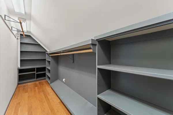 a spacious bedroom with a bed and a couch