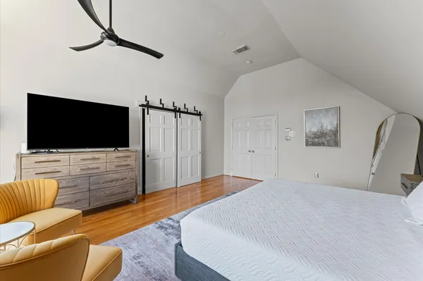 a bedroom with a bed and a table with chair
