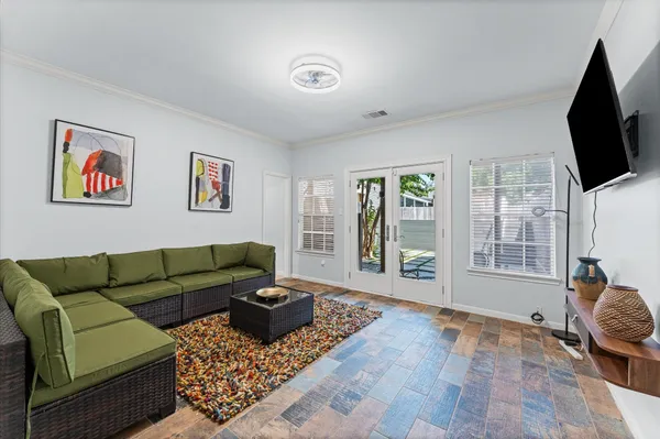 a living room with furniture and a flat screen tv