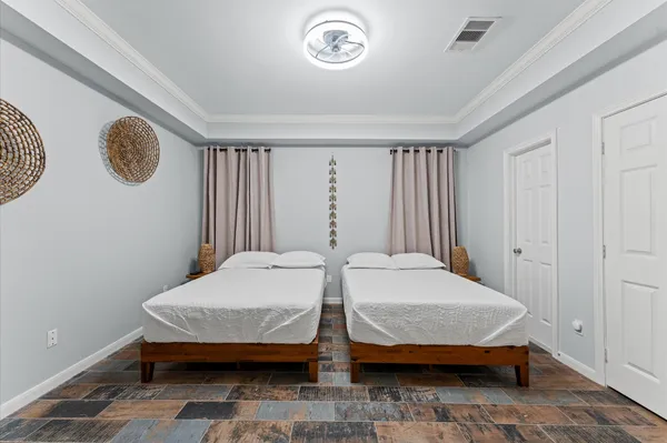 a bedroom with a bed and a chair in it