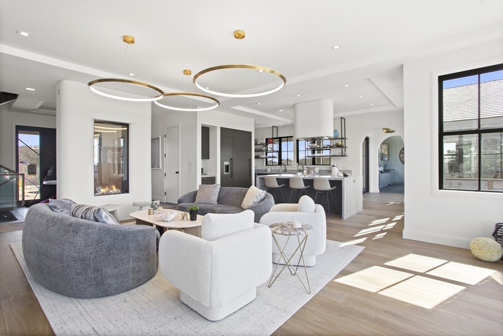 10 Maxey Pond Road Nantucket, MA 02554 - Photo 14 of 35 a living room with furniture kitchen view and large windows