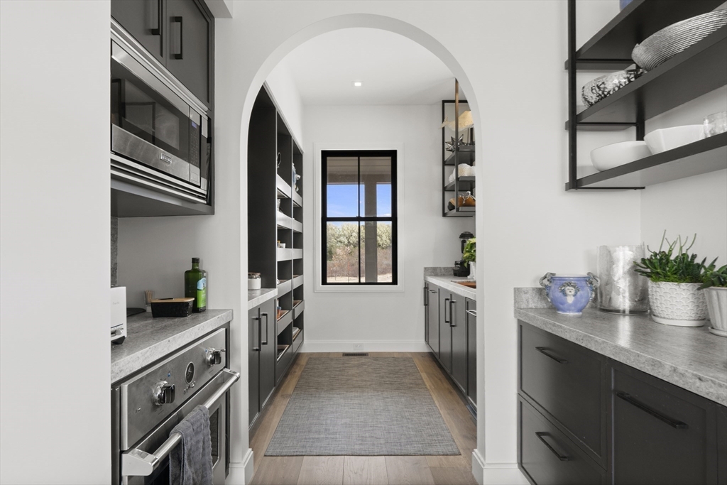 10 Maxey Pond Road Nantucket, MA 02554 - Photo 21 of 35 a kitchen with granite countertop a sink and dishwasher a oven with wooden floor
