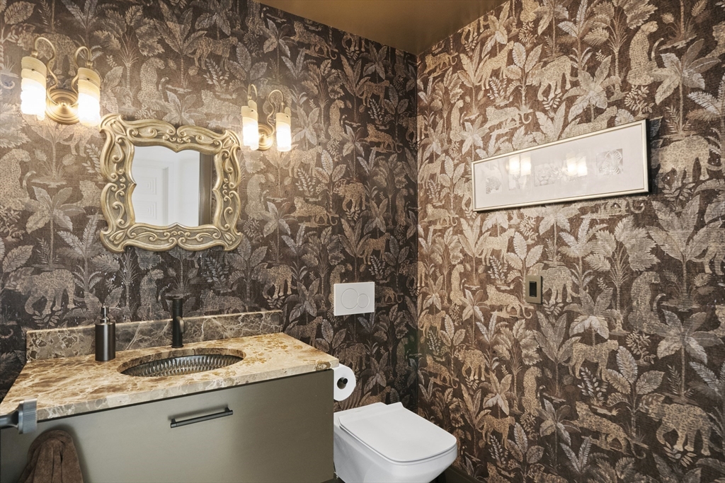 10 Maxey Pond Road Nantucket, MA 02554 - Photo 23 of 35 a bathroom with a toilet sink and mirror