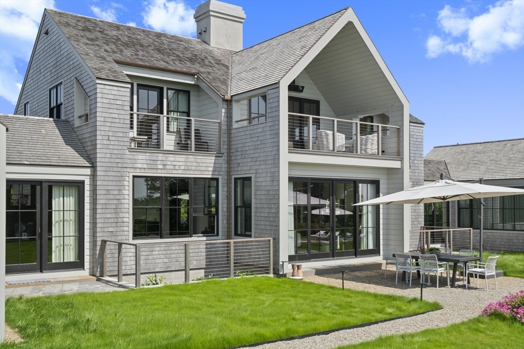 10 Maxey Pond Road Nantucket, MA 02554 - Photo 6 of 35 a front view of house with yard and outdoor seating