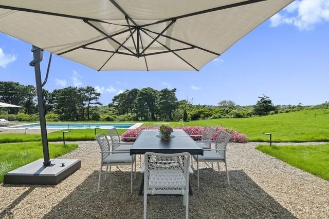 a view of yard with seating area and green space