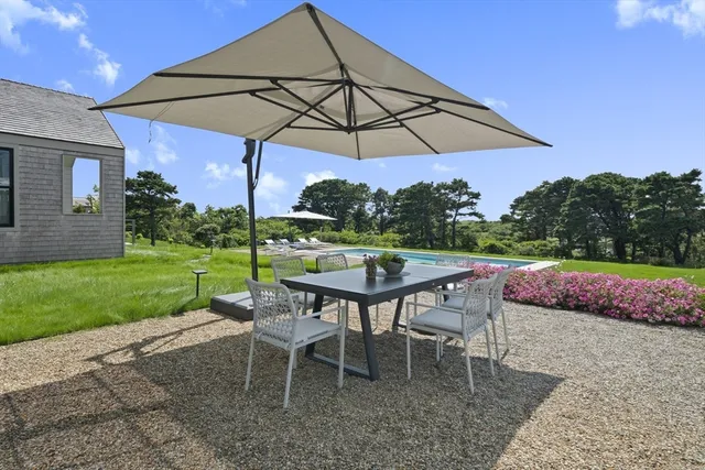 a table and chairs in the garden