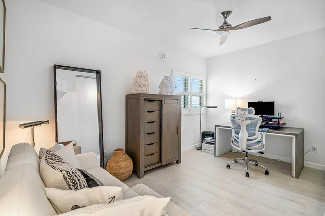 a bedroom with a bed and a chair