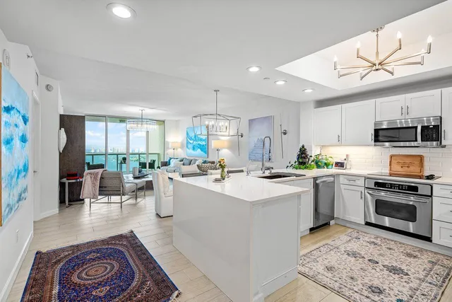 a kitchen with a sink stove and refrigerator