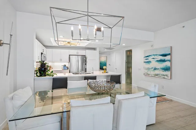 a kitchen with a table and cabinets