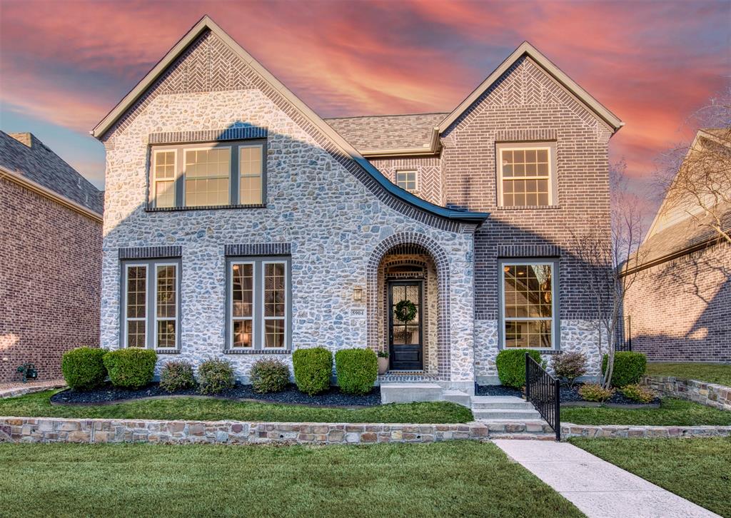 5904 Rutland Road McKinney, TX 75070 - Photo 1 of 40 View of front of house featuring a front lawn, brick siding, and stone siding
