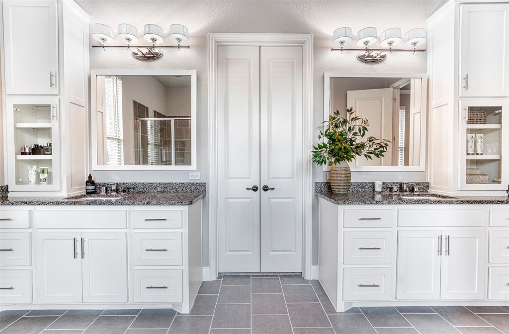 5904 Rutland Road McKinney, TX 75070 - Photo 18 of 40 Full bathroom with a stall shower, two vanities, and a closet