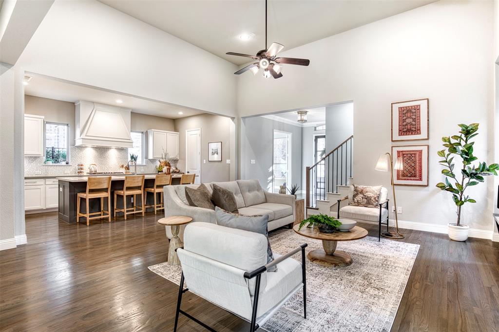 5904 Rutland Road McKinney, TX 75070 - Photo 9 of 40 Living room with a ceiling fan, hardwood floors, a high ceiling, and recessed lighting
