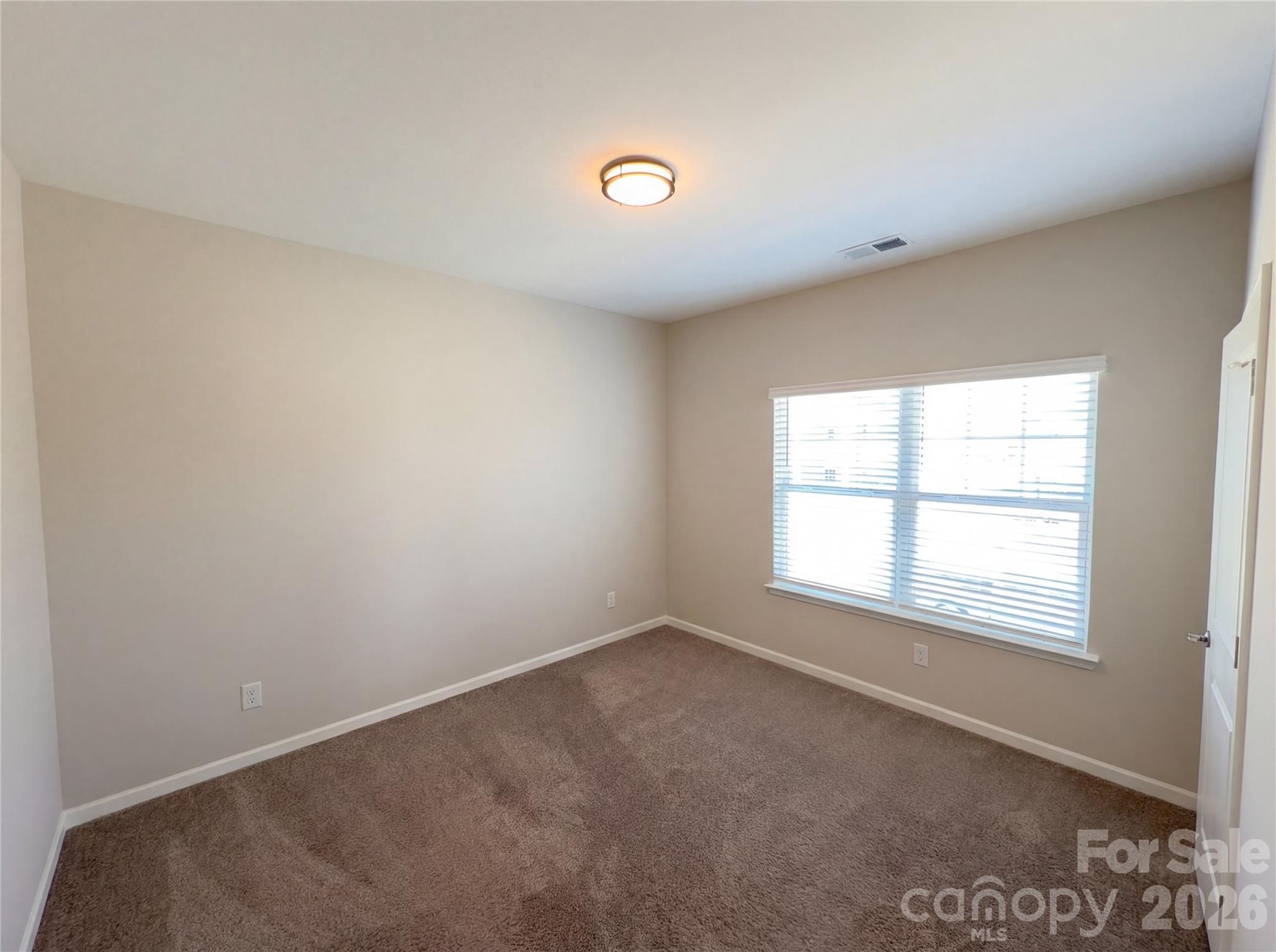 617 Ardsley Drive Locust, NC 28097 - Photo 9 of 23 an empty room with a window