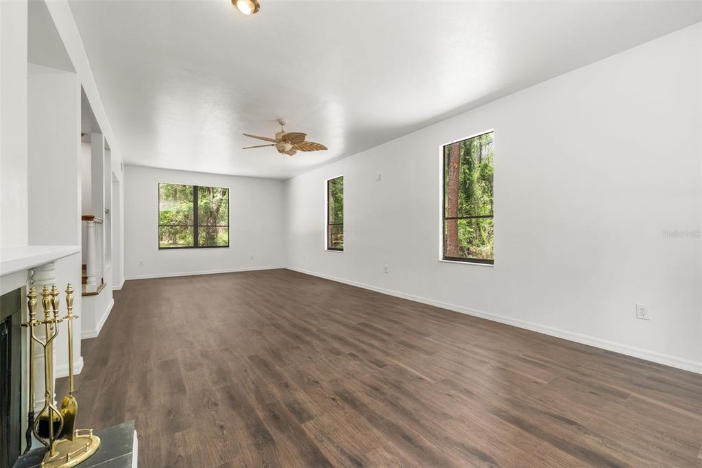 4703 Northwest 124th Street Gainesville, FL 32606 - Photo 10 of 55 wooden floor in an empty room with a window