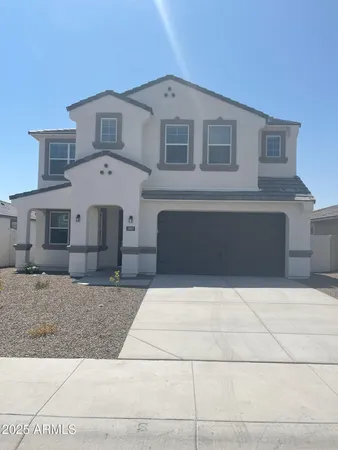 a front view of a house with garage