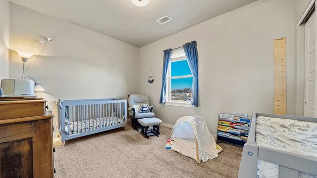 a bedroom with furniture and a window