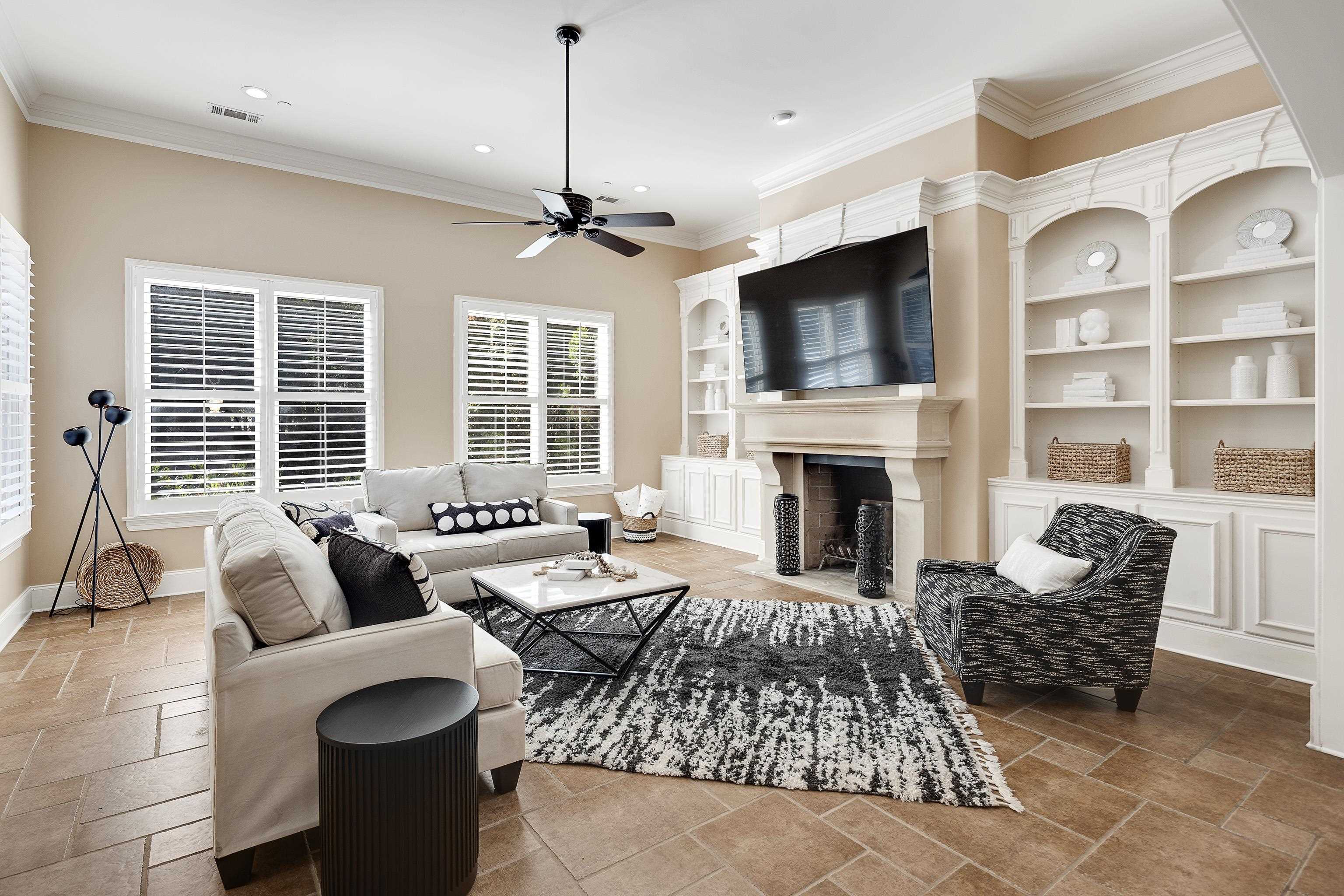 425 Buckland Cove Eads, TN 38028 - Photo 14 of 29 Living area featuring crown molding, a fireplace, stone tile flooring, ceiling fan, and recessed lighting