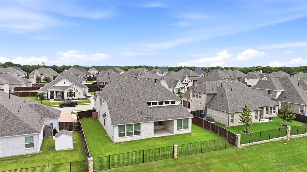 1313 Kirkwood Road Rockwall, TX 75087 - Photo 5 of 39 Backyard with iron fence.