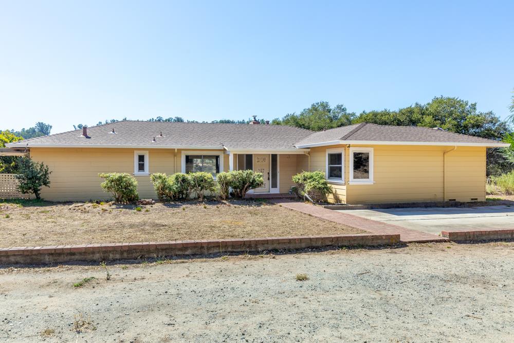 417 Maher Road Watsonville, CA 95076 - Photo 3 of 37 a view of a house with a dry yard and palm trees