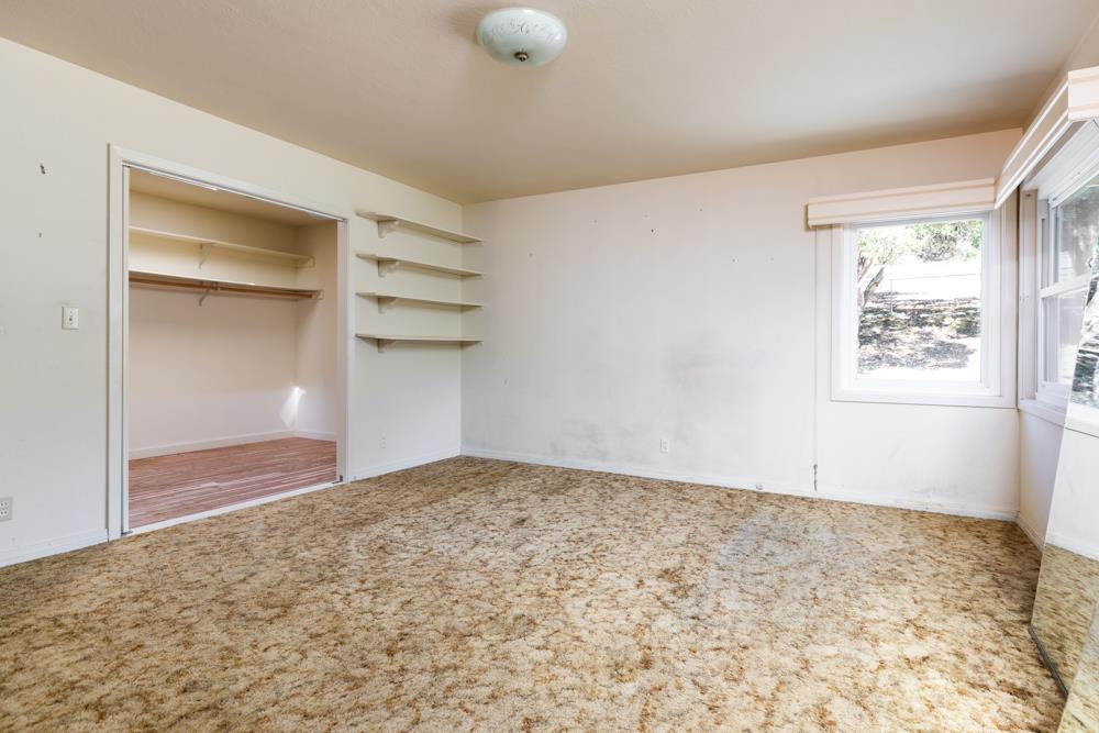 417 Maher Road Watsonville, CA 95076 - Photo 10 of 37 a view of an empty room with a window