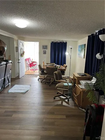 a living room with furniture window and a flat screen tv