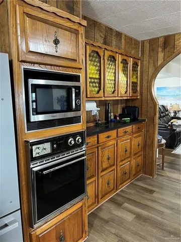 a kitchen with stainless steel appliances a stove and a microwave