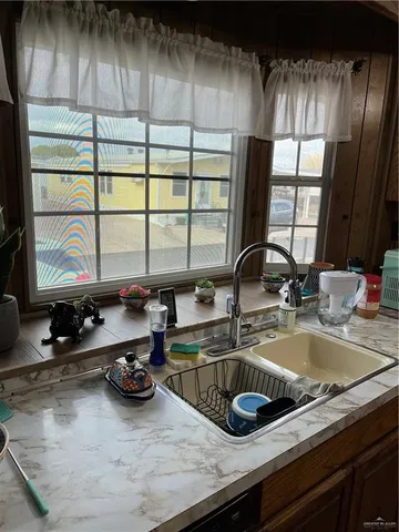 a kitchen with a sink and a window
