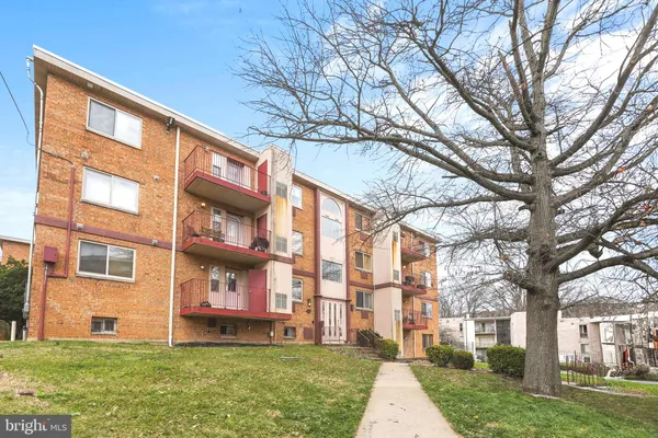 a view of a building with a yard