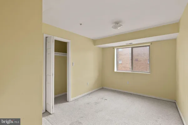 a view of an empty room with a window