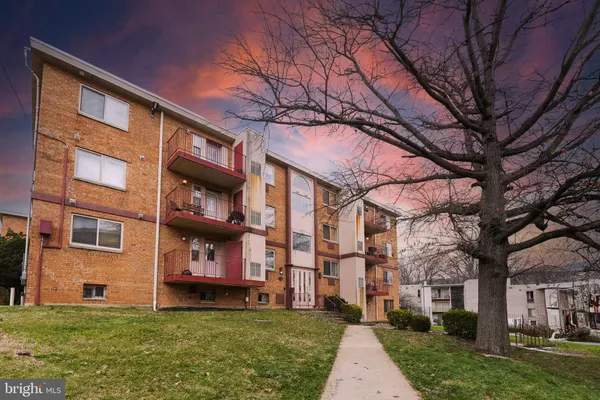 a view of a building with a yard