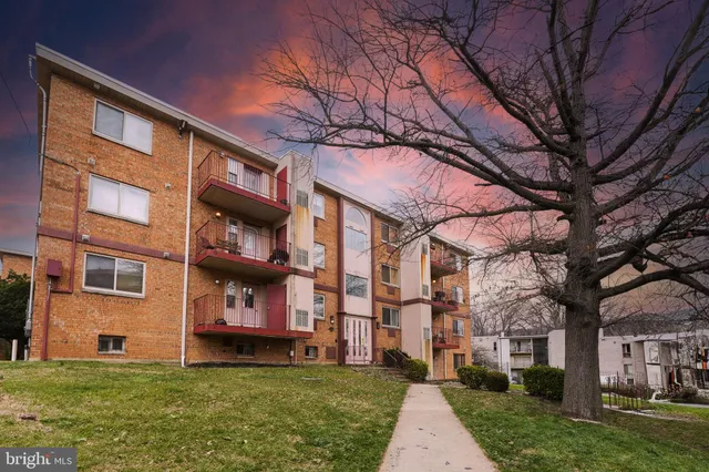 a view of a building with a yard