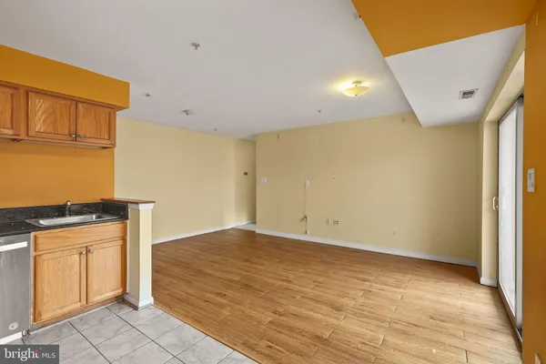 a view of a kitchen with wooden floor