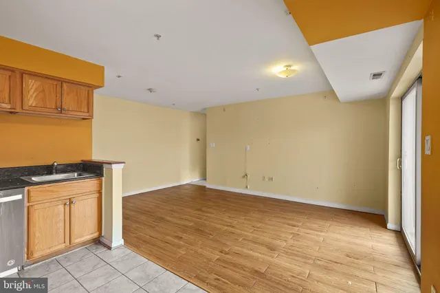a view of a kitchen with wooden floor