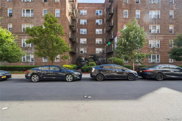 a view of a car parked in front of a buildings