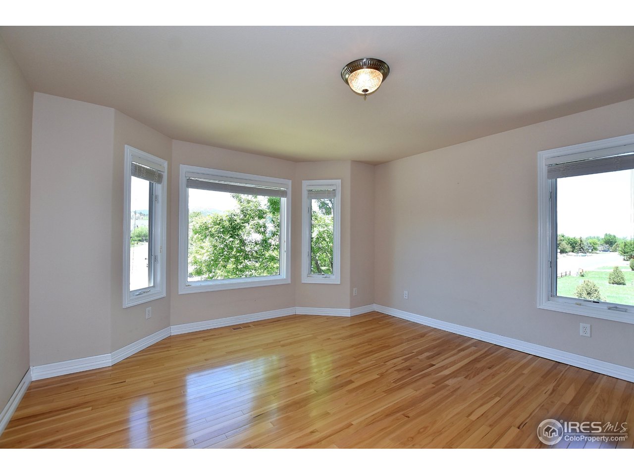 4202 Red Fox Road Fort Collins, CO 80526 - Photo 26 of 38 Bedroom #3 - Love these hardwoods!