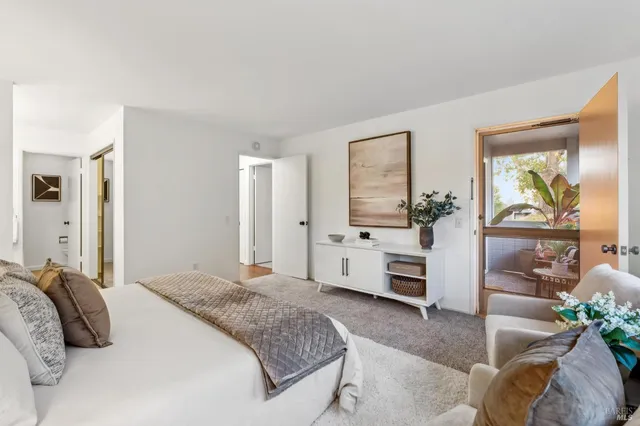 a bedroom with a bed and a couch