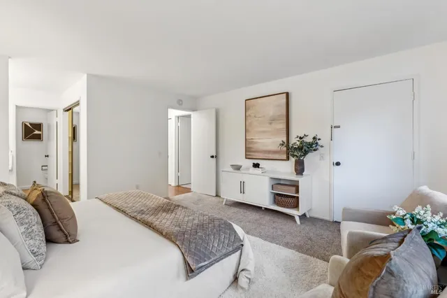 a bedroom with a bed and a couch