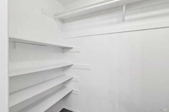 a view of an empty walk in closet