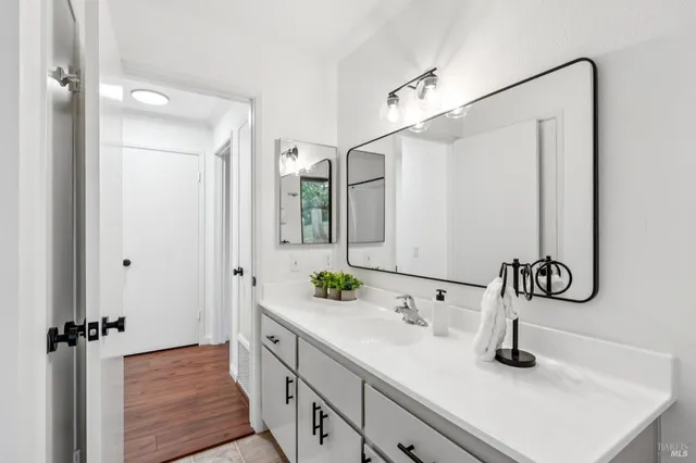 a bathroom with a sink and a mirror