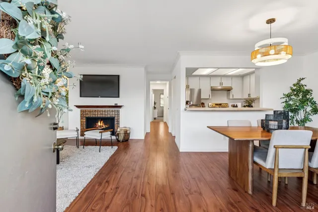 a dining room with furniture and a fireplace