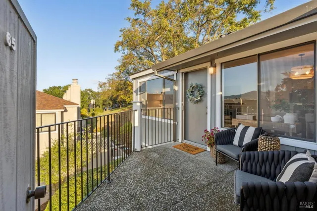 a view of balcony with furniture