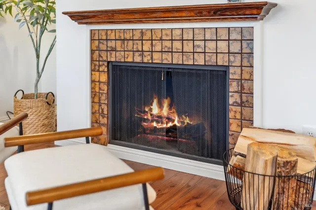 a bedroom with a bed and a fireplace