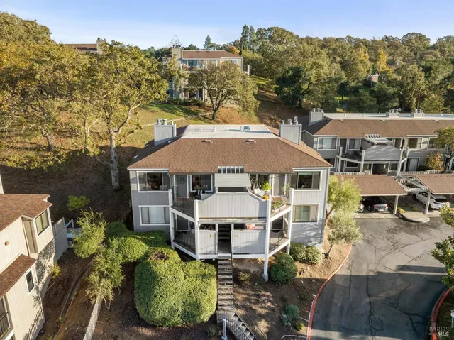 an aerial view of residential houses with outdoor space
