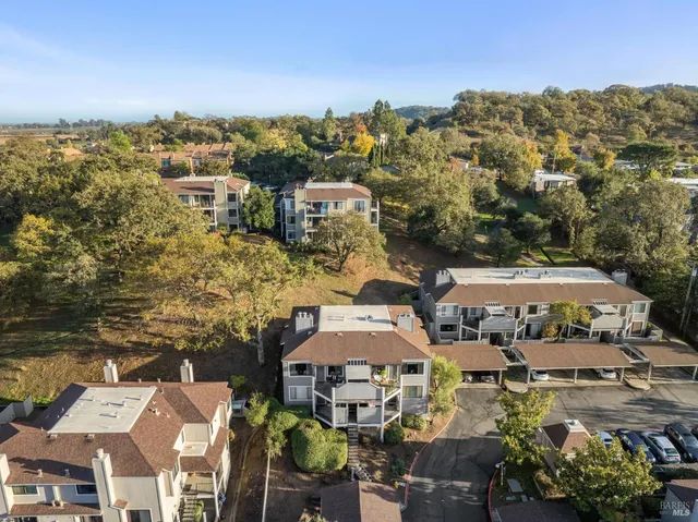 an aerial view of residential building with parking space
