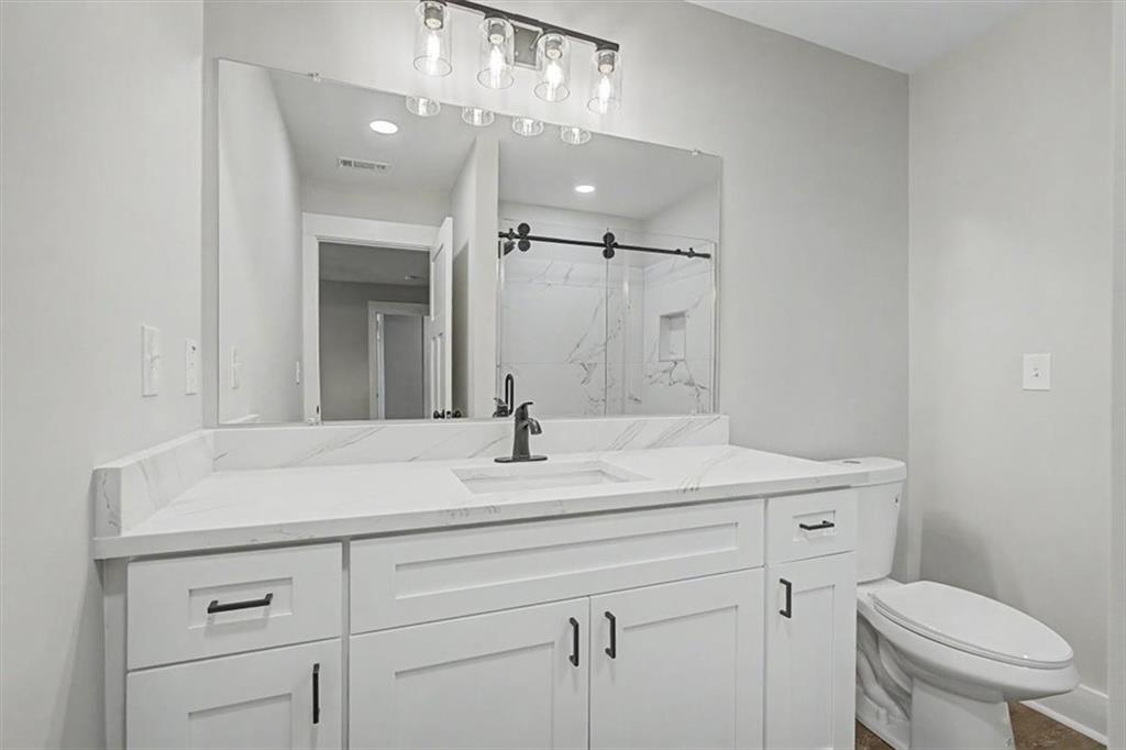 233 Old Old Alabama Road Southeast Emerson, GA 30137 - Photo 23 of 49 a bathroom with a sink a toilet and a mirror